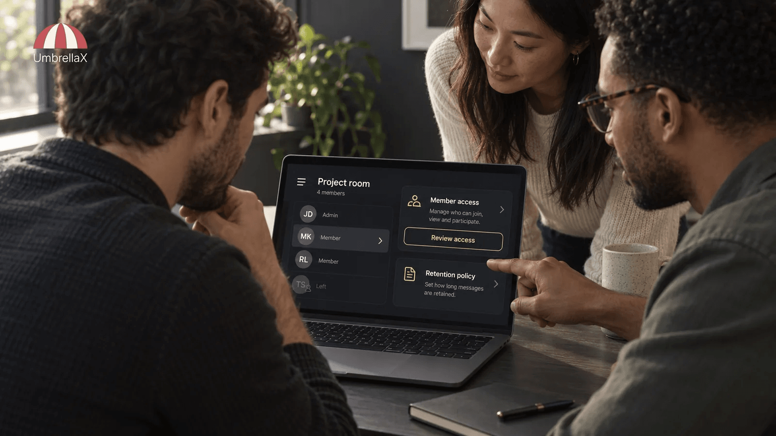 Colleagues review membership and access to a private project room on a laptop.